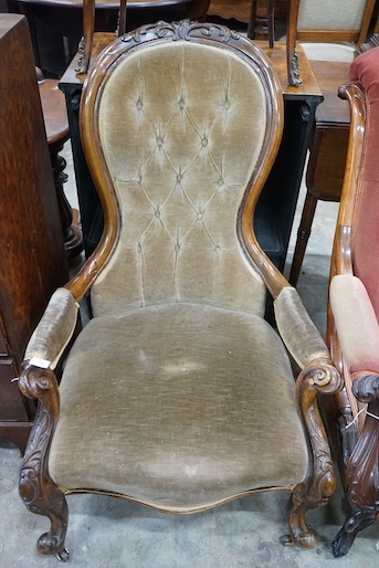 A Victorian carved walnut upholstered spoonback open armchair, width 66cm, depth 72cm, height 98cm